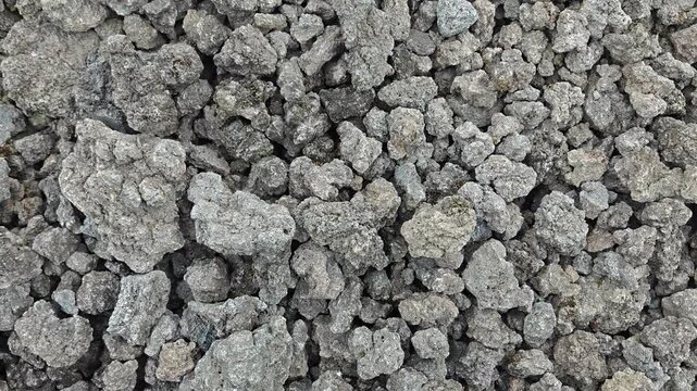 Closeup texture of rough volcanic rock gravel and pebbles