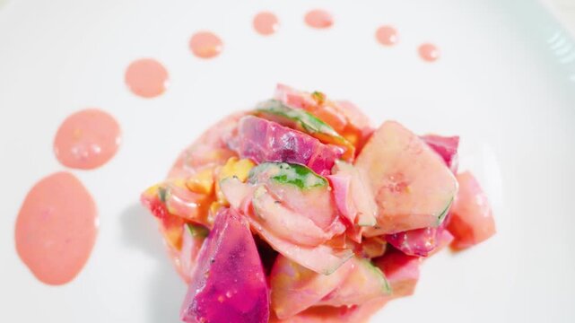 Gourmet Creamy Beet Root and Cucumber Salad Plated with Dressing Drops