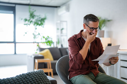 Man receiving good news feeling surprised and joyful