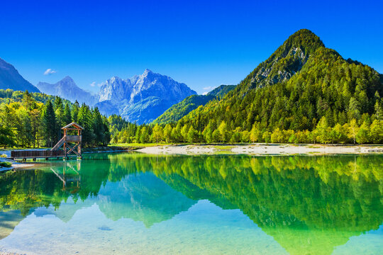 Observation tower on Jasna lake in Kranjska Gora, Slovenia. Julian Alps in background.