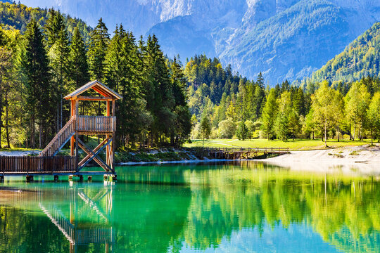 Observation tower on Jasna lake in Kranjska Gora, Slovenia. Julian Alps in background.