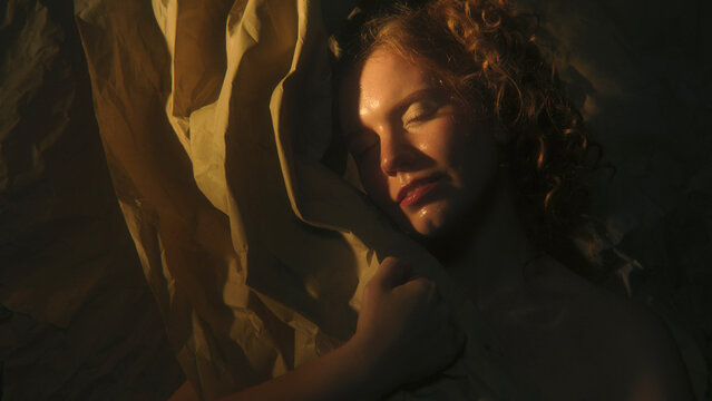Female Portrait Divided Between Golden Illumination and Deep Shadow Explores Emotional Duality, Uncertainty and Inner Conflict. Striking Contrast Creates Conceptual Image About Opposing Feelings.