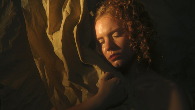 Female Portrait Divided Between Golden Illumination and Deep Shadow Explores Emotional Duality, Uncertainty and Inner Conflict. Striking Contrast Creates Conceptual Image About Opposing Feelings.