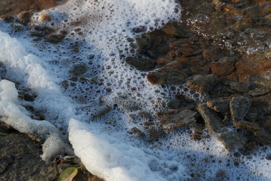 Waves on the shore with foam&mdash;close-up