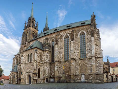 Exterior view of the Cathedral of Saints Peter and Paul in Brno, Czech Republic. A Gothic architectural landmark with detailed stonework, tall pointed windows, and soaring twin towers.