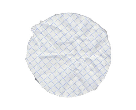 Circular piece of graph notebook paper with diagonal blue grid lines, intersecting surface creases and a ragged outline with an upper left notch on transparent background