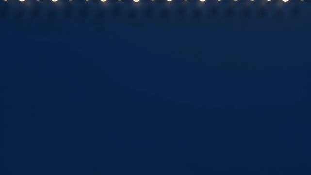 Warm white holiday string lights move upward against a dark blue background