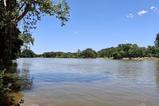 The flowing river on a sunny day.