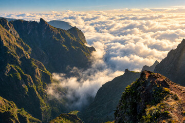 Clouds drifting between sunlit mountain ridges at Pico do Arieiro © Andrei