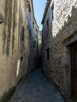 Narrow cobblestone alley in old village