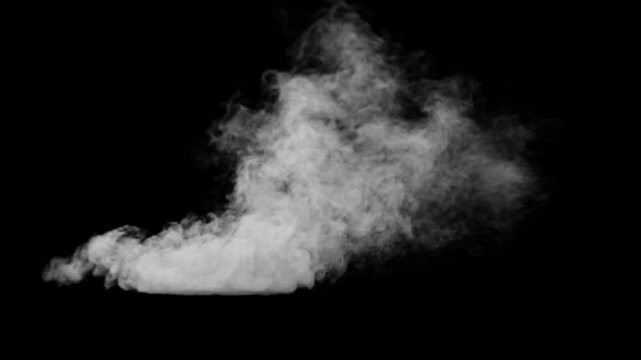 White smoke erupting and spreading on black background