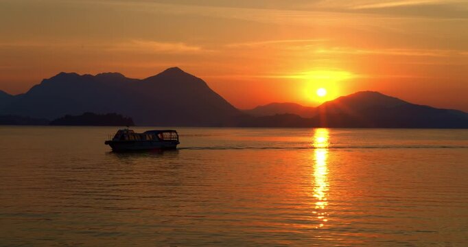  Landscape with a boat at dawn on the lake.