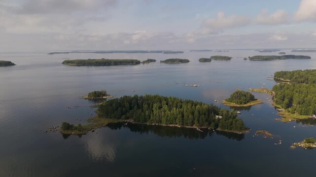 Aerial view of the Gulf of Finland featuring lush green islands and calm waters near Hamina, Kymenlaakso, Finland.