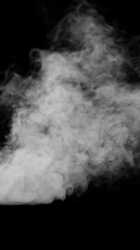 White smoke erupting and spreading on black background