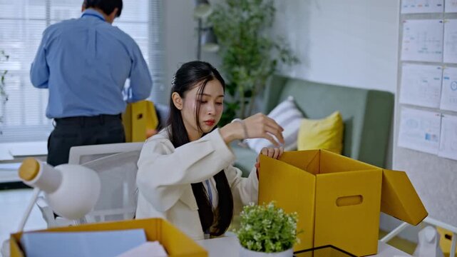 businesswoman packing into cardboard box due to job layoff,worker replaced by AI automation,career retirement,ai disruption and modern technology,Digital Disruption,Document Management Data System