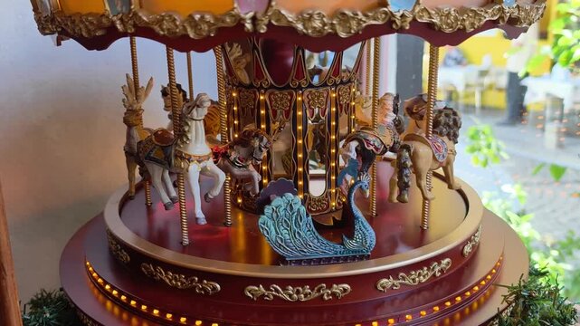 Detailed view of a decorative carousel with various animals in a colorful display