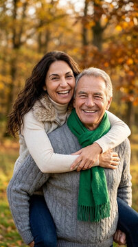 Happy older couple embracing outdoors in autumn, symbolizing love, companionship, and joyful aging, perfect for lifestyle or family themes