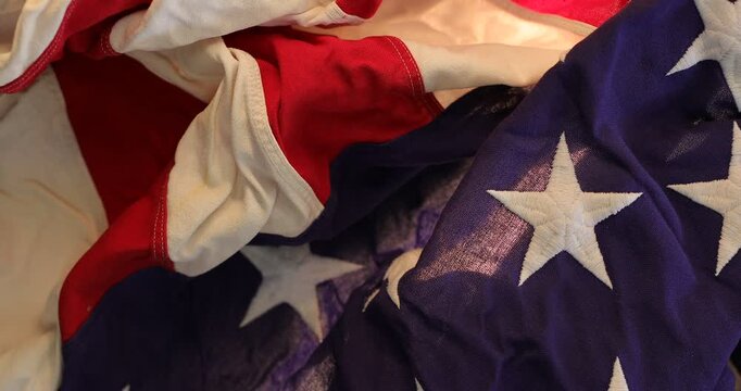 Crumpled American flag textured fabric background showing stars and