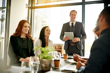 Boardroom, group and man with tablet, meeting or new ideas for funding opportunity or...