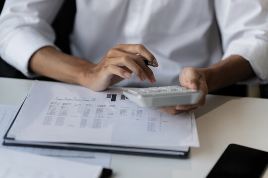 male calculating personal financial for future plan at his home, taxes payment