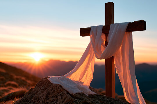 Christian cross with a white shroud on a mountain at sunrise. Easter resurrection concept symbolizing faith, hope, and salvation