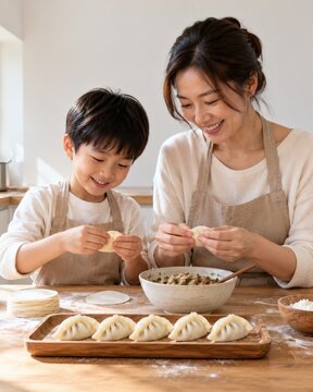 Mother and son making dumplings together in a bright kitchen