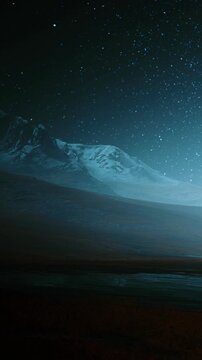 Mountains rise against a night sky filled with stars. The dark terrain shows shadows and highlights from the light of the stars. The scene is quiet and vast, conveying a sense of wonder.