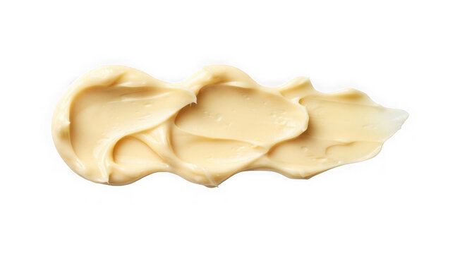 Close up of smooth peanut butter swirl isolated on a black background