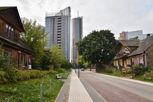Juxtaposition of Traditional Wooden Houses and Modern Skyscraper Skyline in Heritage Neighborhood of &Scaron;nipi&scaron;kės in Vilnius, Lithuania