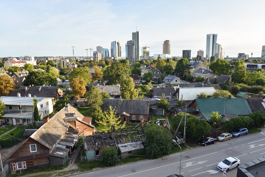 Juxtaposition of Traditional Wooden Houses and Modern Skyscraper Skyline in Heritage Neighborhood of &Scaron;nipi&scaron;kės in Vilnius, Lithuania