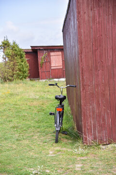 A Bike Leaning Against Wooden Sheds by the Baltic Sea in Nida, Lithuania