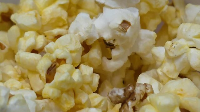 close up top view of fresh butter salty popcorn background texture ideal for cinema movie snack concept