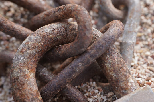 Old rusty metal chains at old ship at sea                               