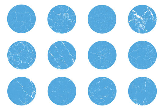 Set of blue circles with grunge distressed textures and crack patterns isolated on a white background