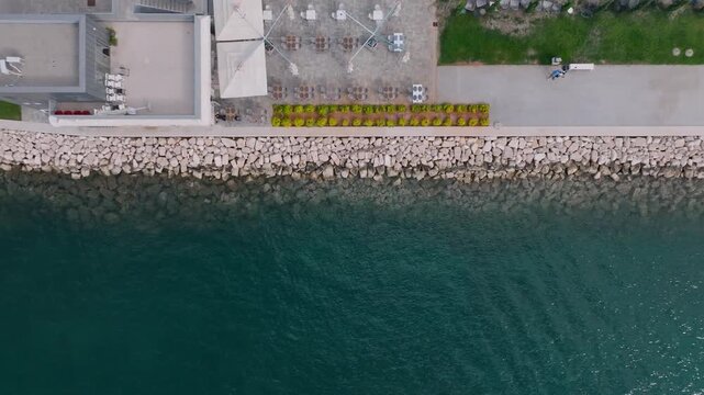 Aerial view of Marina Polesana Pula with stone embankment and clear sea water in Pula, Istarska zupanija, Croatia.