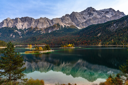 Zugspitze and Eibsee lake with autumn foliage and mountain reflection in Grainau, Bavaria