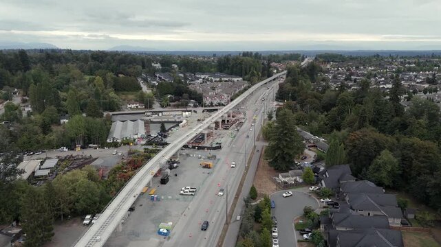 Ongoing Construction Of Surrey Langley Skytrain Line With Traffic In Surrey, BC, Canada. - aerial shot