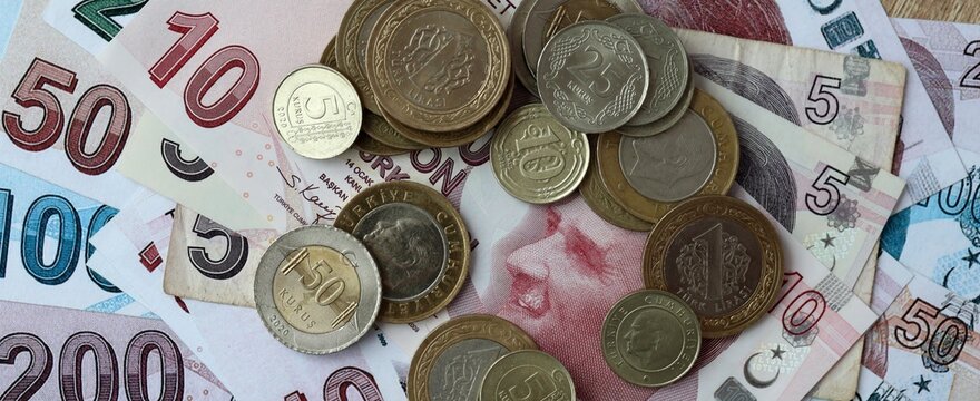 Turkish lira money bills and coins on table. Turkey cash of TRY currency close up