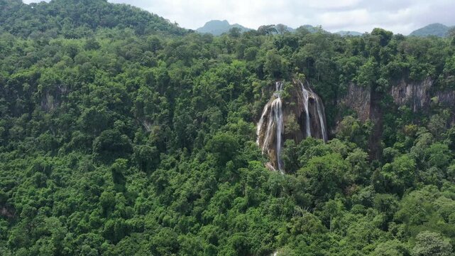 Hua Chang Waterfall (Elephant Head) is the uppermost tier of the Erawan Waterfall during the rainy season, formed by the rainforest within Erawan National Park in Kanchanaburi Province, Thailand
