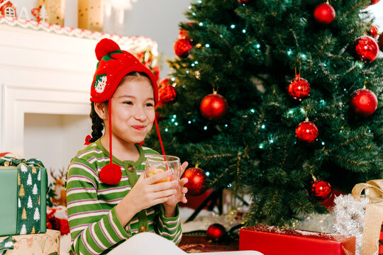 Happy Girl Enjoying Christmas Holiday Beside Decorated Festive Tree