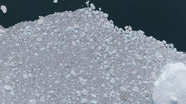 Aerial view of floating icebergs and sea ice in the Ilulissat Icefjord, Ilulissat, Avannaata Municipalit, Greenland.