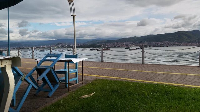 Empty Blue Wooden Chairs by Izmit Bay Coastline