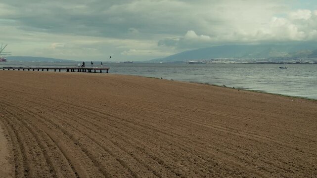 People on Wooden Pier at Izmit Bay Beach