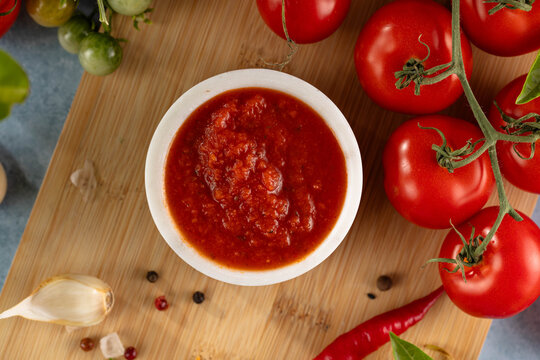 Tomato paste. Fresh tasty tomato sauce with ripe tomatoes and basil