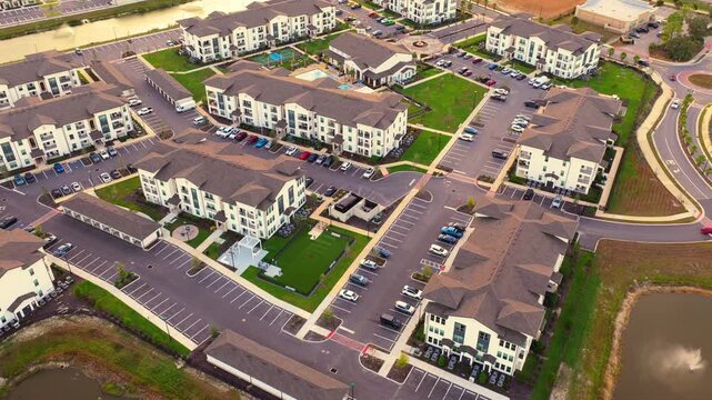 Aerial view of Florida suburban condos at sunset. Housing growth and residential architecture in U.S. communities.