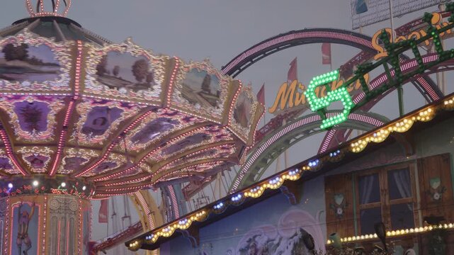 A detail view of rides and electric lighting at Octoberfest in Munich, Germany