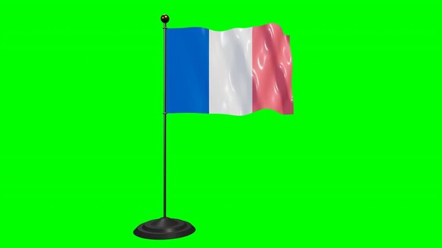 National flag of France waving on a flagpole over a chroma key green screen background