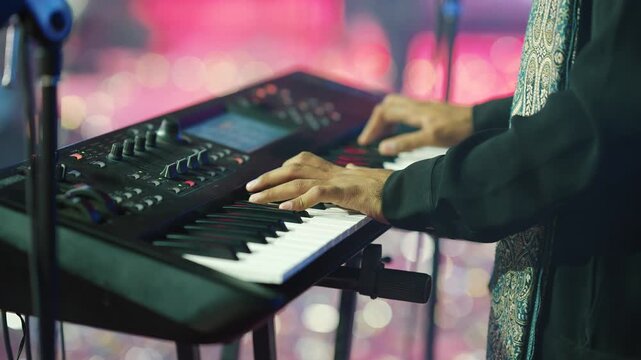 Close Up of Musician Hands Playing Electronic Synthesizer Keyboard on Stage