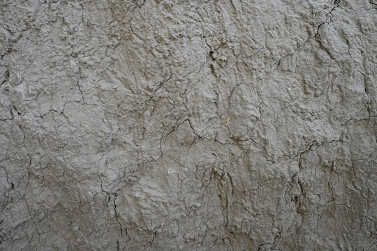 Cracked dry mud wall texture background