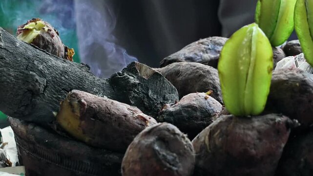 Fresh Green Star Fruit Amrakh, Shakarkandi Carambola with Dark Rustic Ingredients on Moody Dark Background